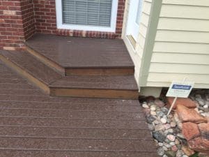 Dark stained deck, step, and landing to back door