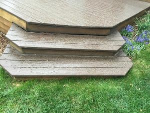 Wood deck with 2 wooden dog eared cornered steps