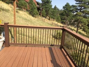 Wooden deck and 3 level steps down an incline