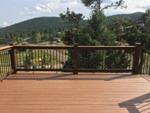 Wooden deck and 3 level steps down an incline