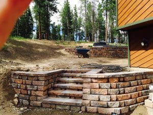 Paver steps enclosed with pavers and a multi paver low wall
