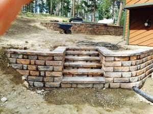 Paver steps enclosed with pavers and a paver low wall