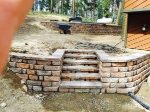 Paver steps enclosed with pavers and a paver wall