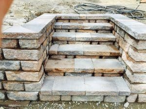 Paver steps enclosed with pavers and a paver wall